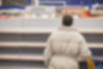 Man looking an empty shelf