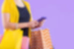 A girl with a mobile phone shopping